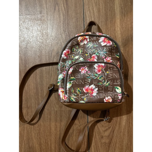 Ninewest Handbags - Small Nine West floral purse backpack. Minor flaw on‎ back in pictures.